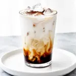 creamy iced dirty chai latte with oat milk - featured image