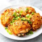 crispy baked honey garlic chicken thighs - featured image